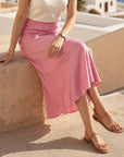 Woman wearing Eva Bias Ankle Skirt with fluid silhouette and elastic waistband