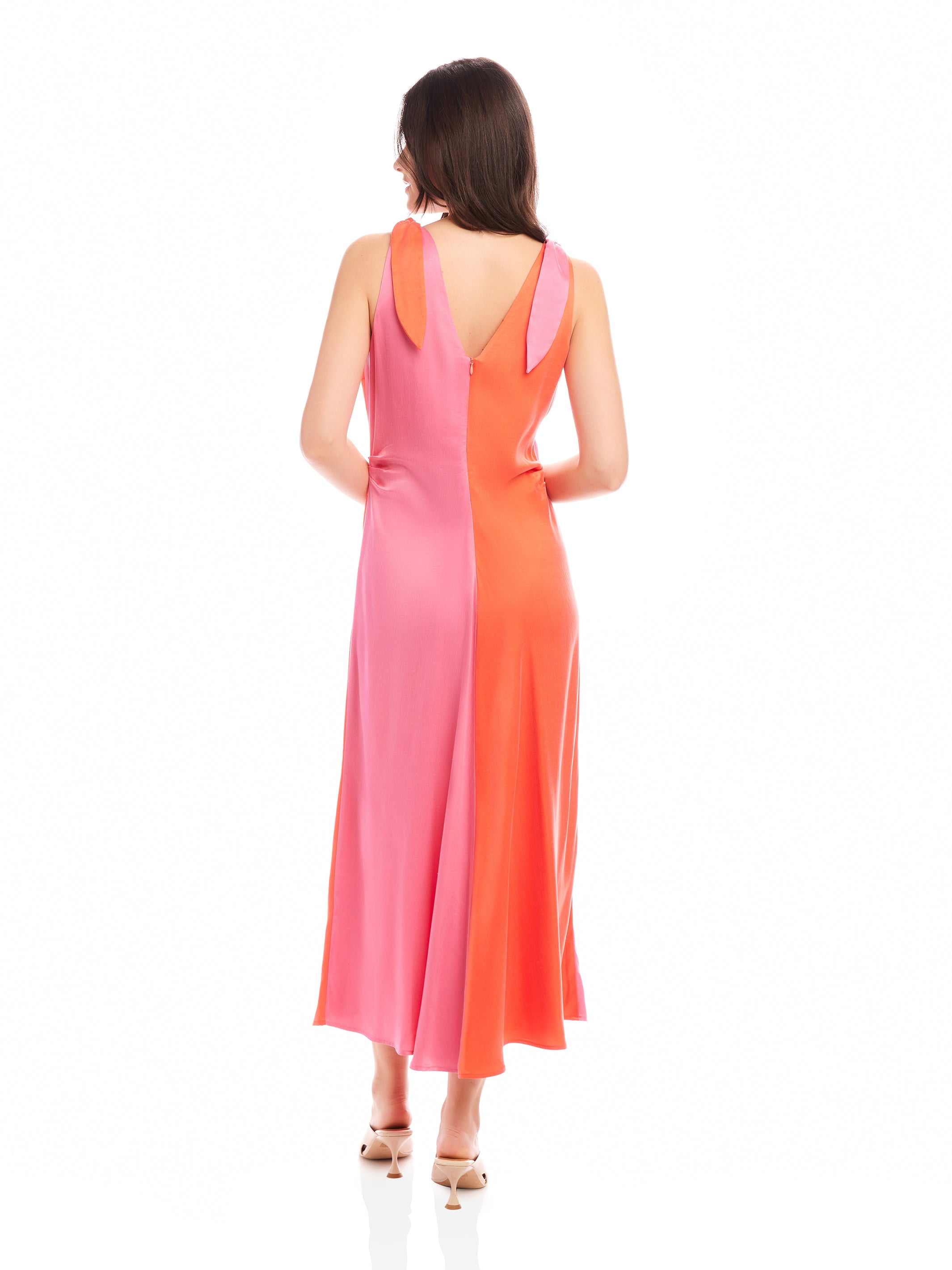 Back view of Verity Two-Tone Midi Dress in coral and pink with A-line silhouette and pleated detail