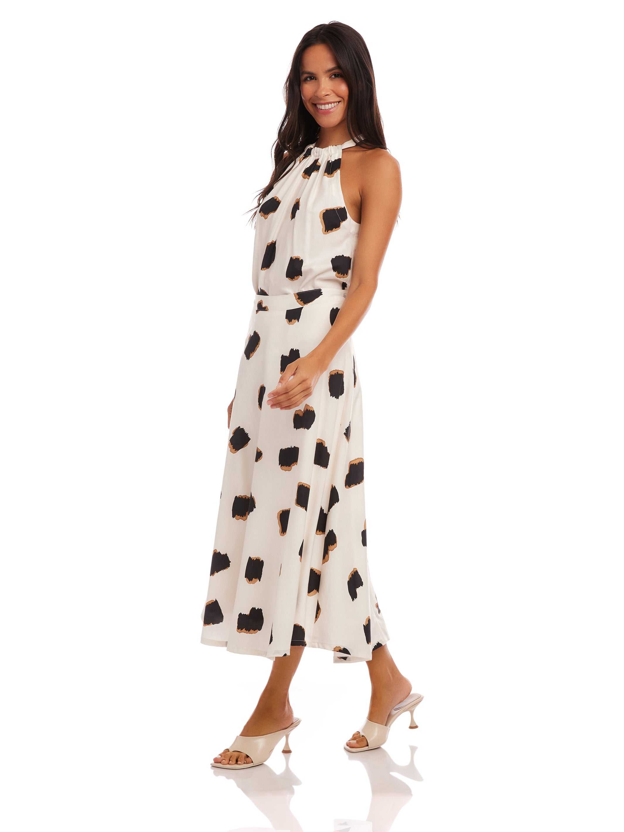 Woman wearing Lexi Skirt high-waisted midi flowy skirt with Sahara Twill print and matching top