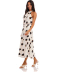 Woman wearing Lexi Skirt high-waisted midi flowy skirt with Sahara Twill print and matching top