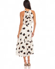 Woman wearing a high-waisted, flowy midi Lexi Skirt with Sahara twill print and side zipper closure from the back