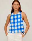 Woman wearing sleeveless Beatrix Button Tank with blue Italian watercolor check print and round neckline.