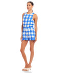 Woman wearing Betty Picnic Shorts in blue and white watercolor check print with elastic waist and side pockets, styled with matching sleeveless top.