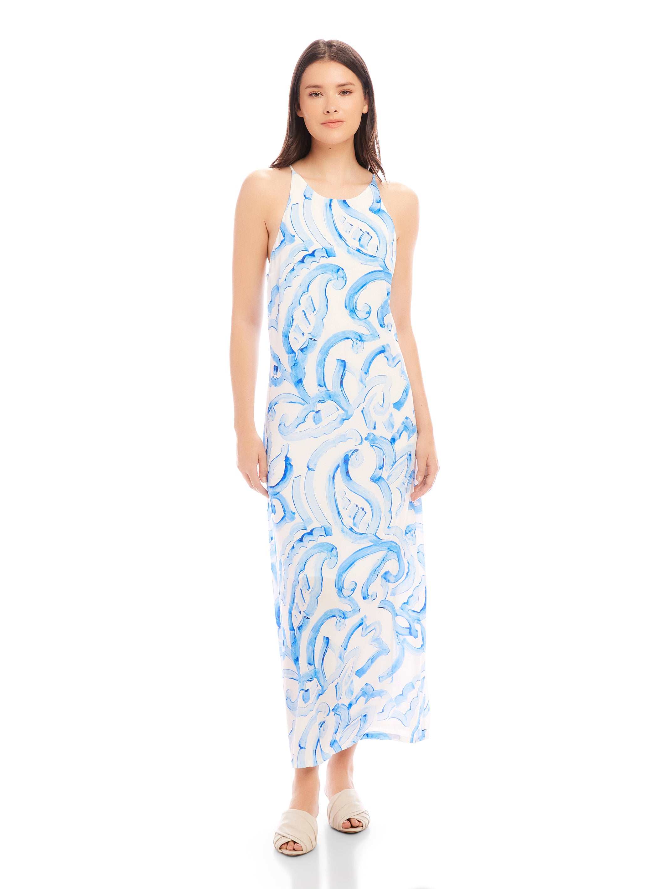 Woman wearing a blue painted paisley print Sera A-Line Dress with adjustable spaghetti straps and round neck