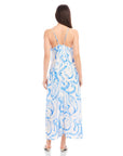Back view of woman wearing blue painted paisley print Sera A-Line Dress with adjustable spaghetti straps and maxi length silhouette