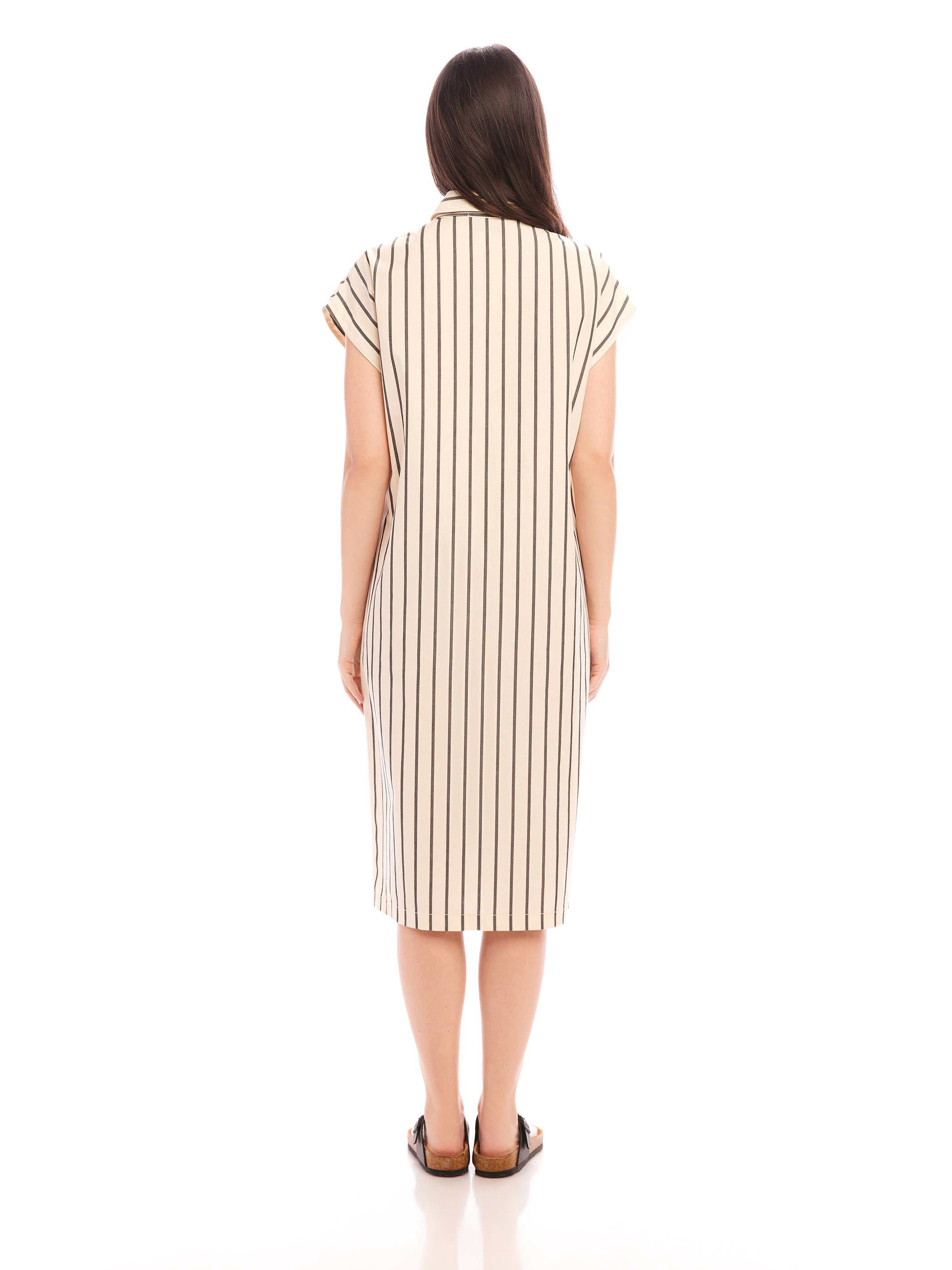 Back view of a woman wearing a Lucia Stripe Dress with boxy fit, cap sleeves, and vertical stripes