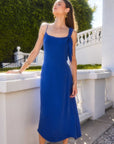 Serena Midi Dress in blue with adjustable shoulder tie and scoop neck, midi length sheath style perfect for elegant occasions