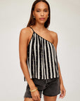 Woman wearing Louetta One-Shoulder Tank with black and white stripes and gold metallic details paired with black shorts