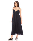 Woman wearing a black Leanna Midi Dress with adjustable spaghetti straps and V-neckline