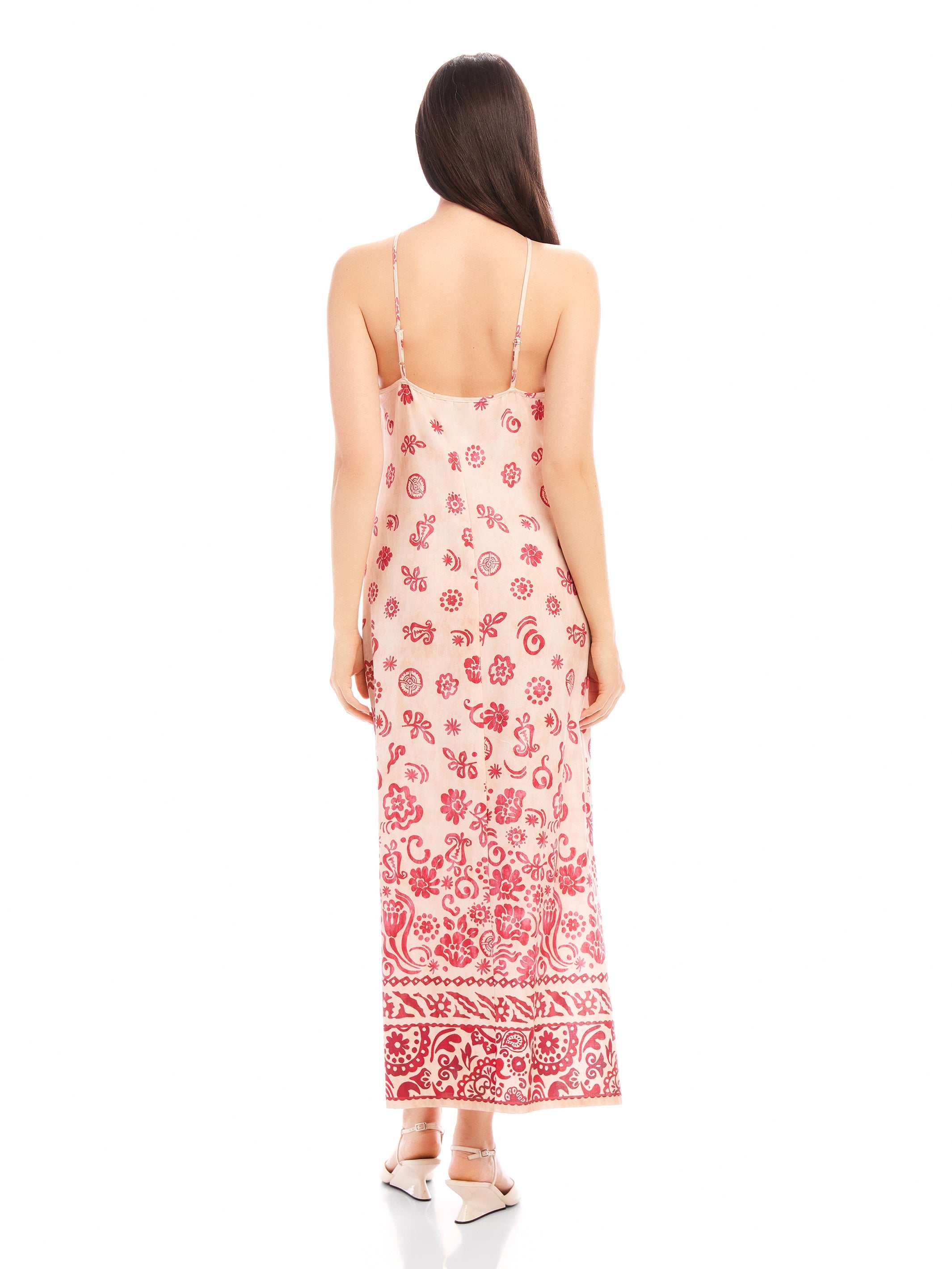 Back view of woman wearing Jaylen Border Print Dress with red floral watercolor border print and adjustable straps