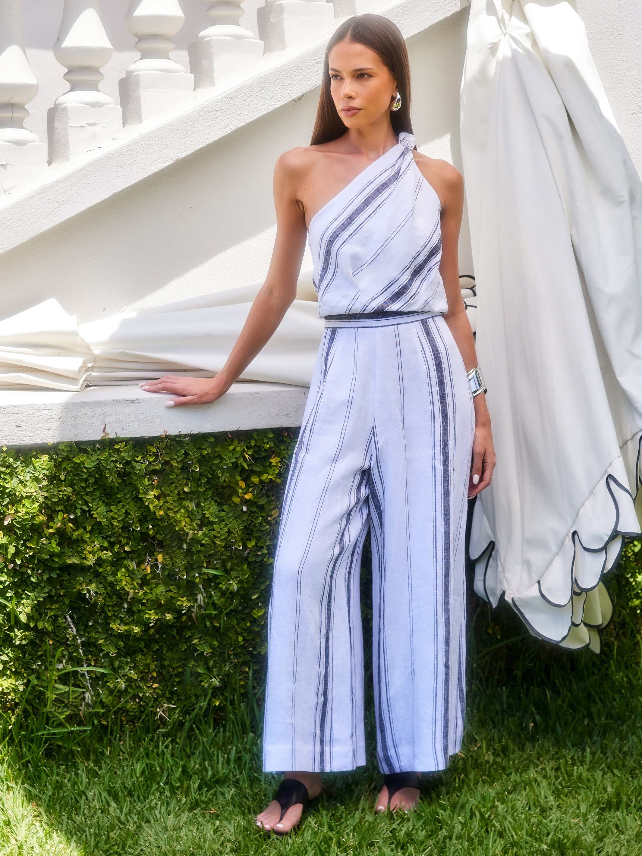 Woman wearing breathable striped Vivienne Wide-Leg Pants with elastic waistband and full length in outdoor setting