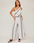 Woman wearing breathable striped Vivienne wide-leg linen blend pants with elastic waistband and full length design