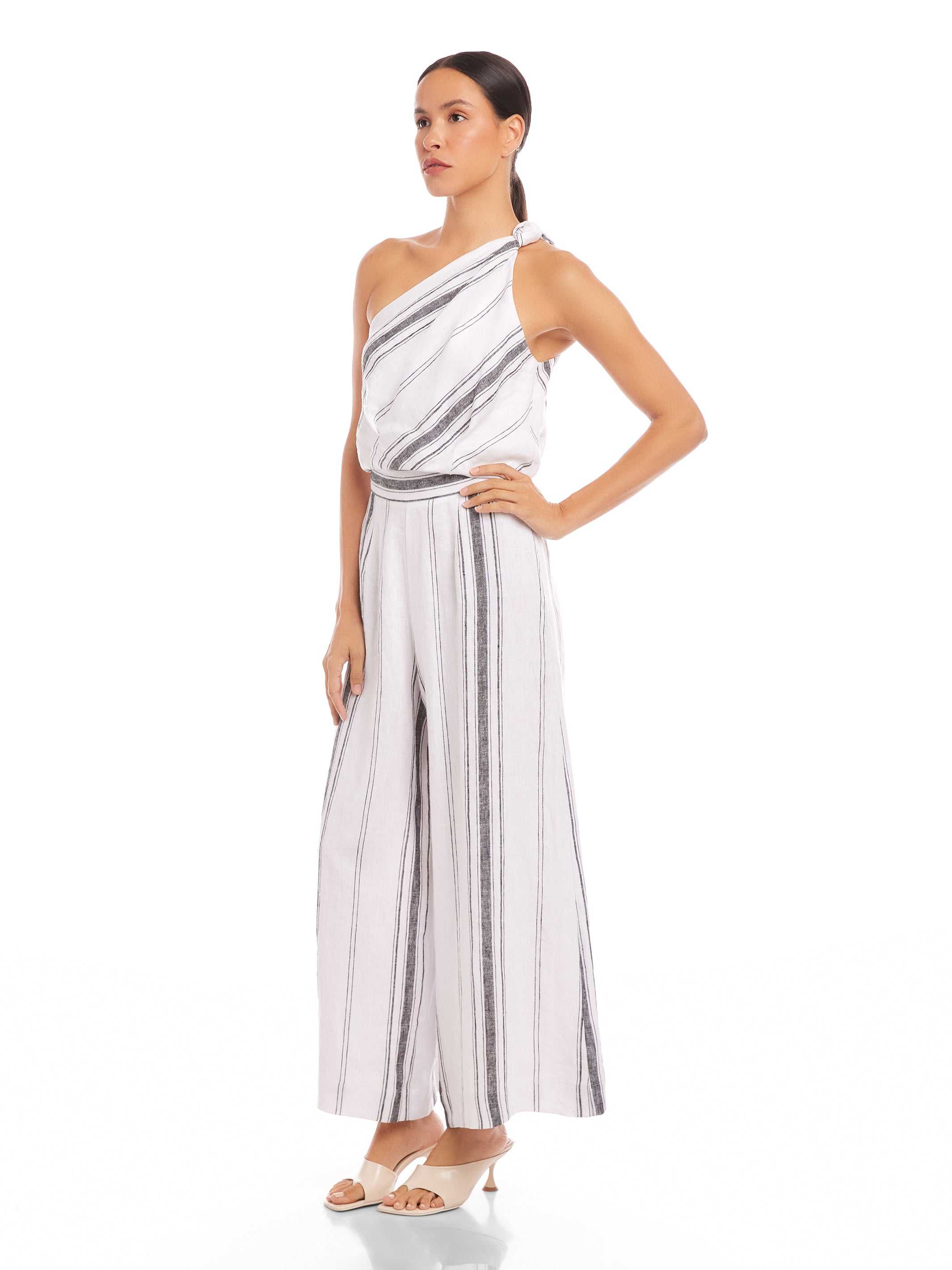 Woman wearing Vivienne Wide-Leg Pants in breathable striped linen blend with elastic waistband and full length wide-leg design.