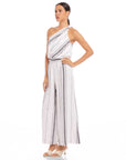 Woman wearing Vivienne Wide-Leg Pants in breathable striped linen blend with elastic waistband and full length wide-leg design.
