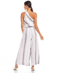 Back view of model wearing Vivienne Wide-Leg Pants in striped linen blend with a relaxed fit and elastic waistband