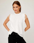 White Nora Fringe Tee with short fringe sleeves and side fringe details, relaxed boxy fit, crew neck, made from cotton spandex jersey.