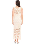 Back view of a woman wearing a sleeveless Kelsie Crochet Dress with floral design and detachable slip, featuring a scoop neckline and side zipper closure.