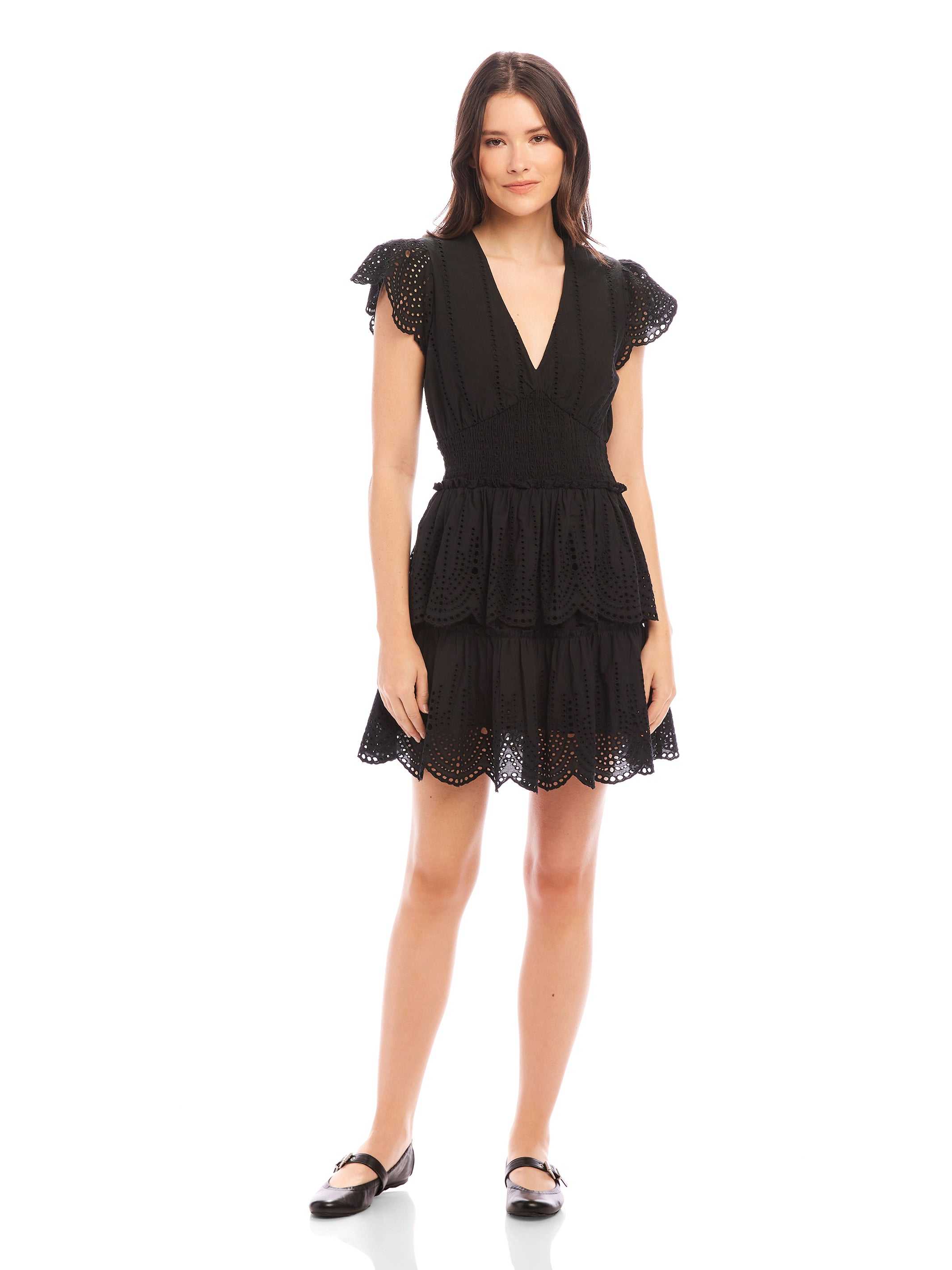 Black Isla Embroidered Tiered Dress with V-neck, cap sleeves, fitted waist, and tiered eyelet skirt on model
