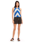 Woman wearing blue and white Alice Crochet Tank with chevron design and black high waist shorts