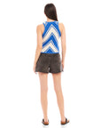 Back view of woman wearing fitted sleeveless Alice Crochet Tank with blue and white chevron pattern paired with black high waist shorts