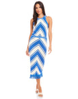 Woman wearing a blue and white amber crochet skirt with chevron pattern and fringe hem paired with matching sleeveless top