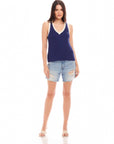 Nicole Sweater Tank sleeveless blue ribbed V-neck sweater tank paired with distressed denim shorts