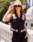 Black sleeveless Mira Rope Stitch Vest with floral embroidery, front buttons, and V-neckline.