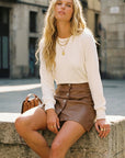 Brown Kinsley Faux Leather mini skirt with front metal buttons, mid-thigh length, sleek modern fit