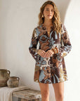 Layne Mini Dress with brown and light blue botanical crepe print, long sleeves, and keyhole neckline