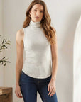 Sleeveless turtleneck top in brushed rib fabric with shirttail hem and comfortable stretch