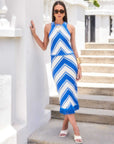 Woman wearing Amber Crochet Skirt with bold chevron pattern and fringe hem paired with matching blue and white top.