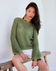 Liv Crochet Sweater with open-weave, flared sleeves, back keyhole, and delicate flower details