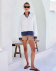Off white and blue Carrie Mixed Media Sweater with faux-layer collar and hem, long sleeves, V-neck, and relaxed fit