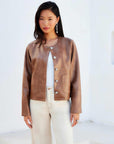 Brown Latte Kaylyn Faux Leather Jacket with metal button closures and scoop neck