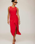 Woman wearing a red Maddie Side-Knot Midi Dress with sleeveless crew neck, side knot detail, and side slit.