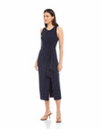 Woman wearing sleeveless navy Maddie Side-Knot Midi Dress with side slit and fitted design