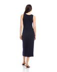 Woman wearing navy sleeveless Maddie Side-Knot Midi Dress with crew neck, back view