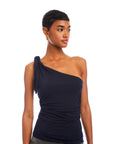 Woman wearing navy Harper One-Shoulder Tie-Top with asymmetrical silhouette and shoulder tie detail