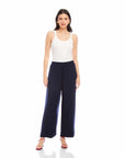 Woman wearing navy Shilo Wide-Leg Ankle Pants with elastic waistband and white tank top