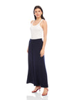 Woman wearing navy Shilo Wide-Leg Ankle Pants with elastic waistband and white tank top