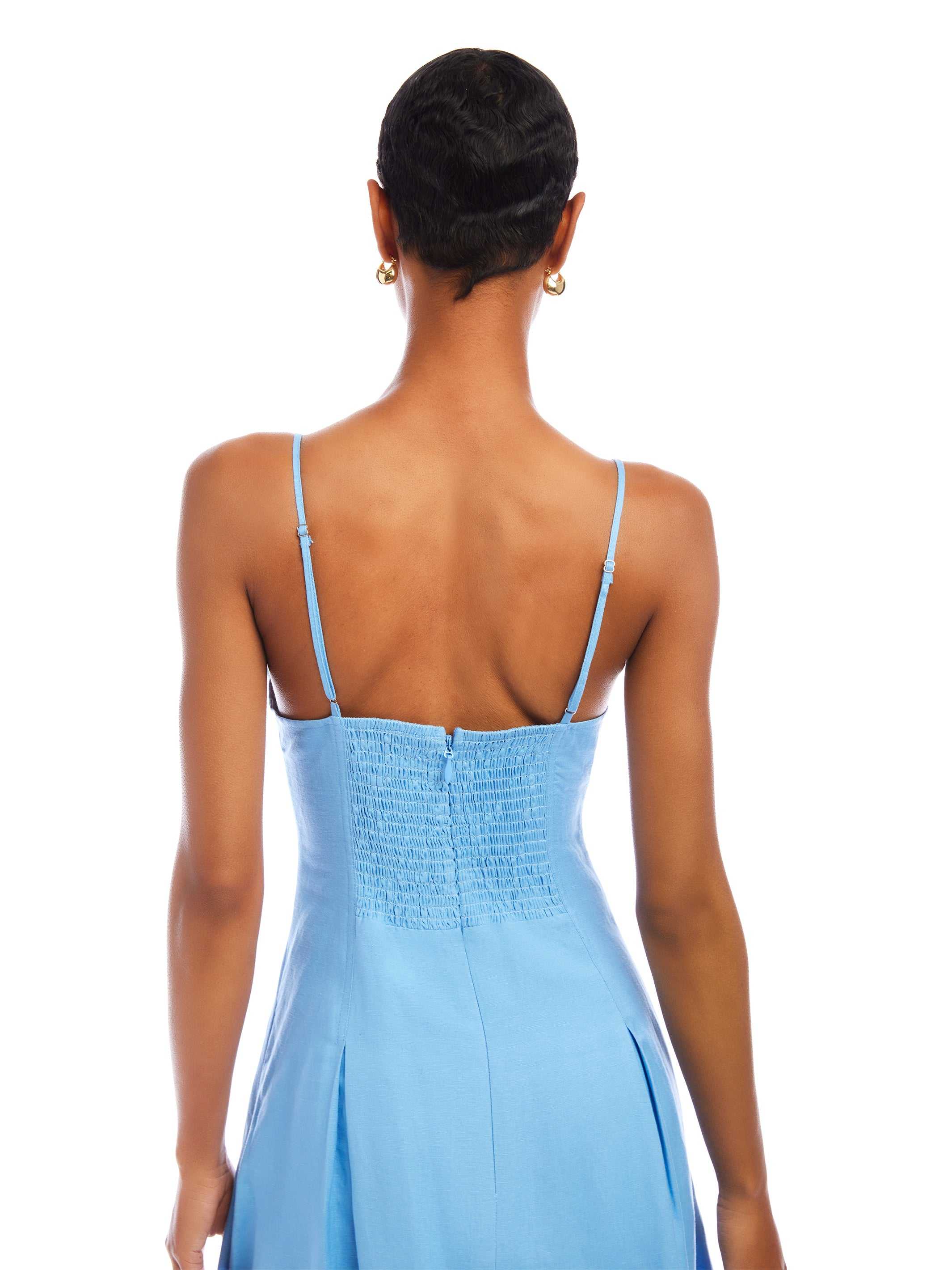 Back view of Jessa Midi Dress in light blue with adjustable straps and fitted bodice
