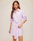 Tatum Ruched Sleeve Shirtdress in lilac cotton poplin, with a collar, button front, ruched sleeves and a self-tie waist.