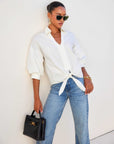 Jena Lantern Sleeve Tie-Front Top in white cotton poplin with collar and V-neckline, featuring statement lantern sleeves and adjustable tie-front waist