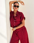 Red Collette Button-Up Top with white pinstripes, collar, and short sleeves in a relaxed fit
