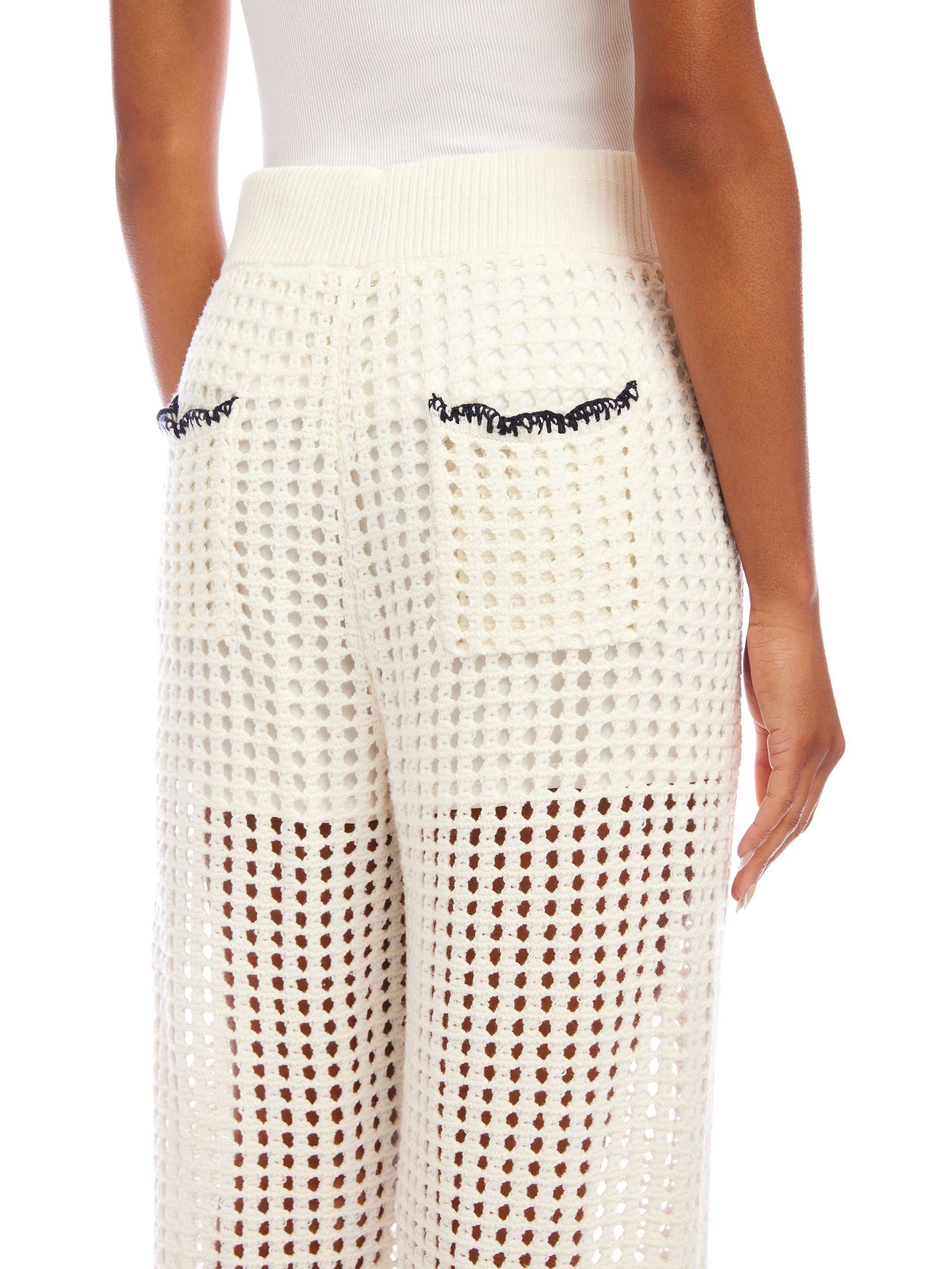 Back view of Gianna crochet pants in white with contrast stitch detailing and drawstring waist