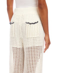 Back view of Gianna crochet pants in white with contrast stitch detailing and drawstring waist