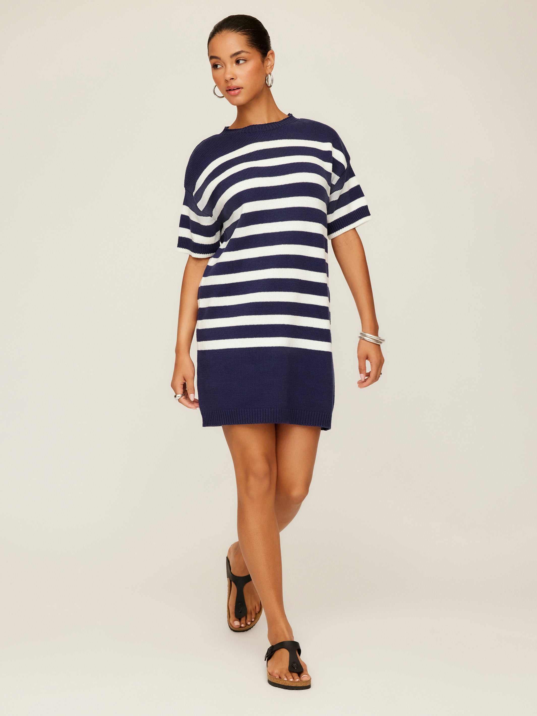 Woman wearing navy and white striped Georgette Sweater Dress with crew neck and drop shoulder sleeves
