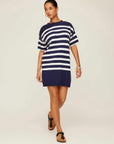Woman wearing navy and white striped Georgette Sweater Dress with crew neck and drop shoulder sleeves