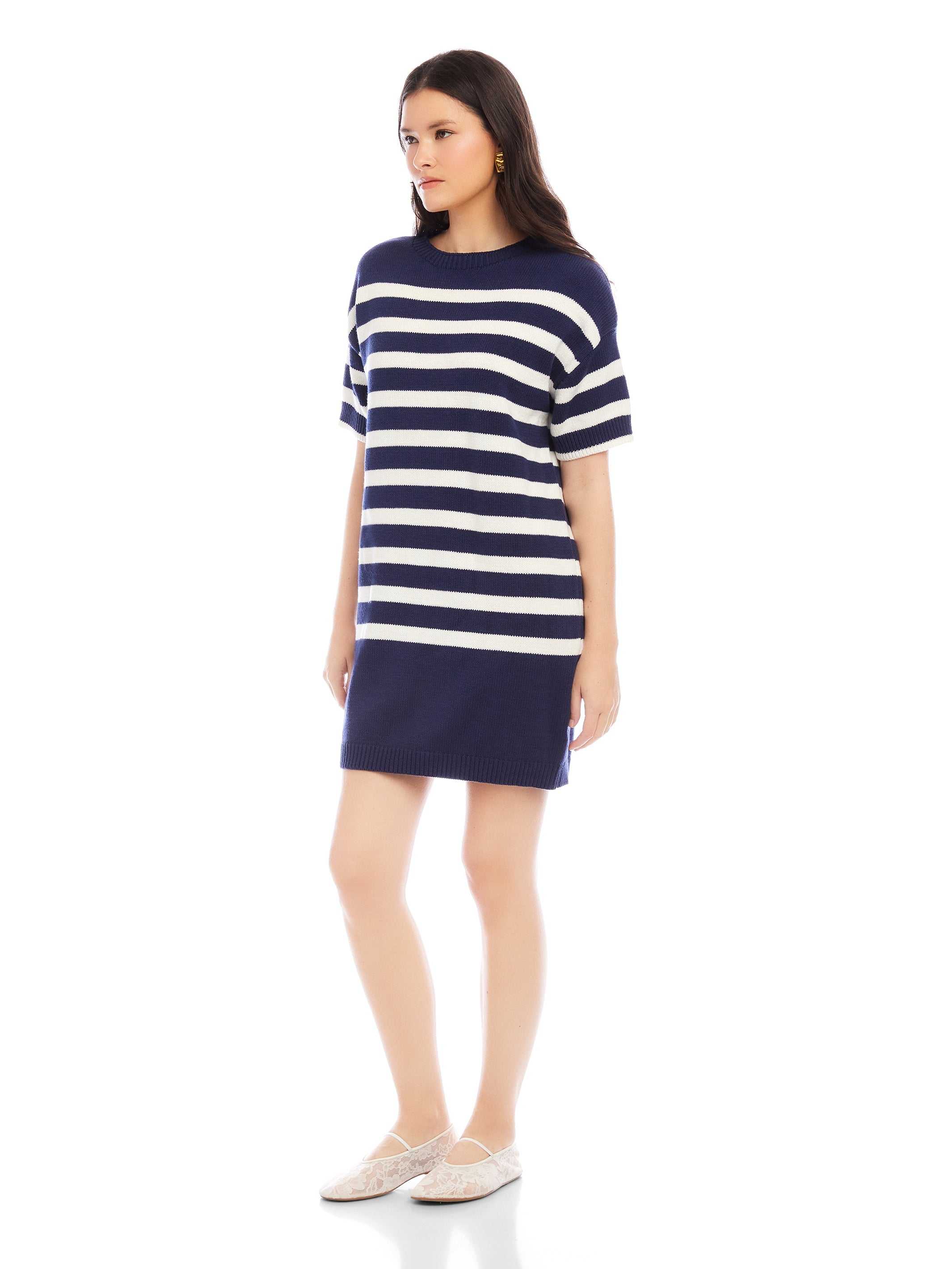 Woman wearing navy and white striped Georgette sweater dress with crew neck and drop shoulder sleeves