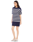 Woman wearing navy and white striped Georgette sweater dress with crew neck and drop shoulder sleeves